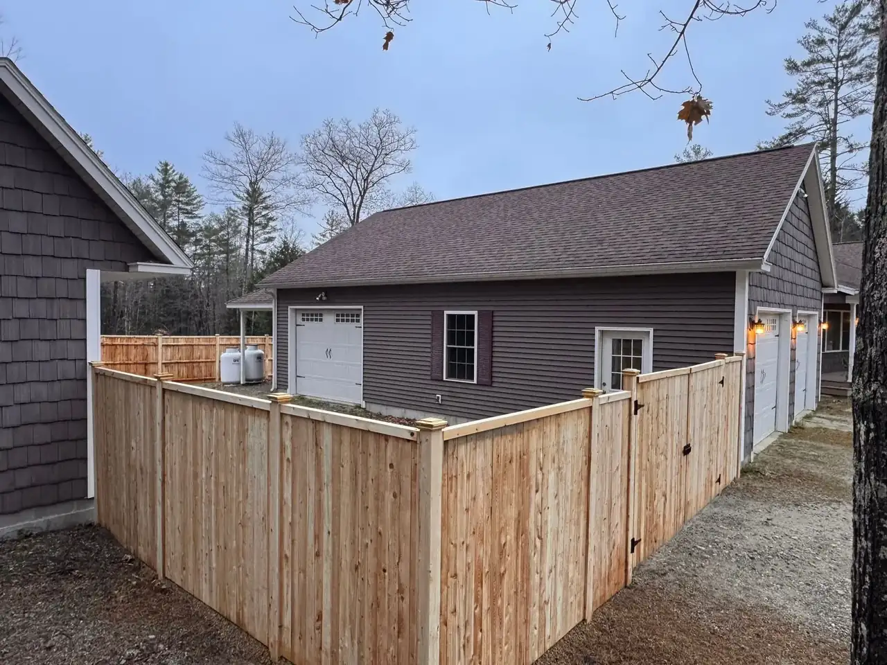 Wood privacy fence alongside a home