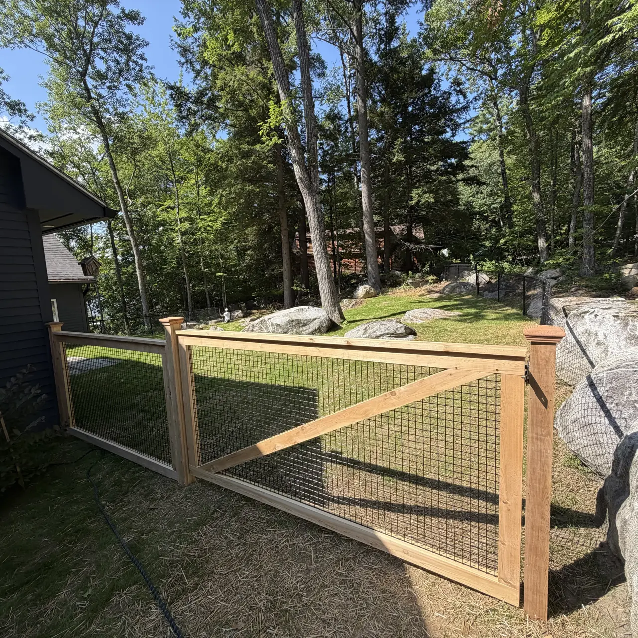Wood framed mesh gate and garden fence
