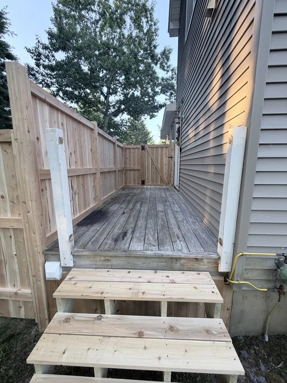 Wood deck with privacy fence and steps